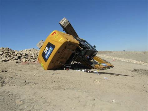 mini excavator on trailer stuck in the ground accident|Excavator Equipment Recovery: How to Deal with a Tipped Over .